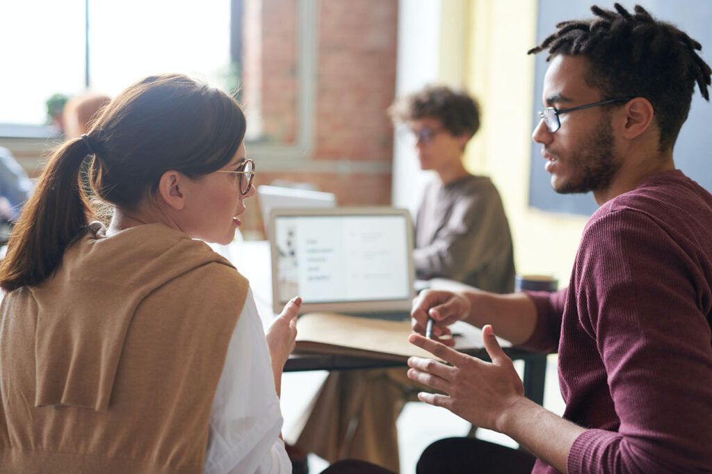 Two team members working on a tailored integration plan.